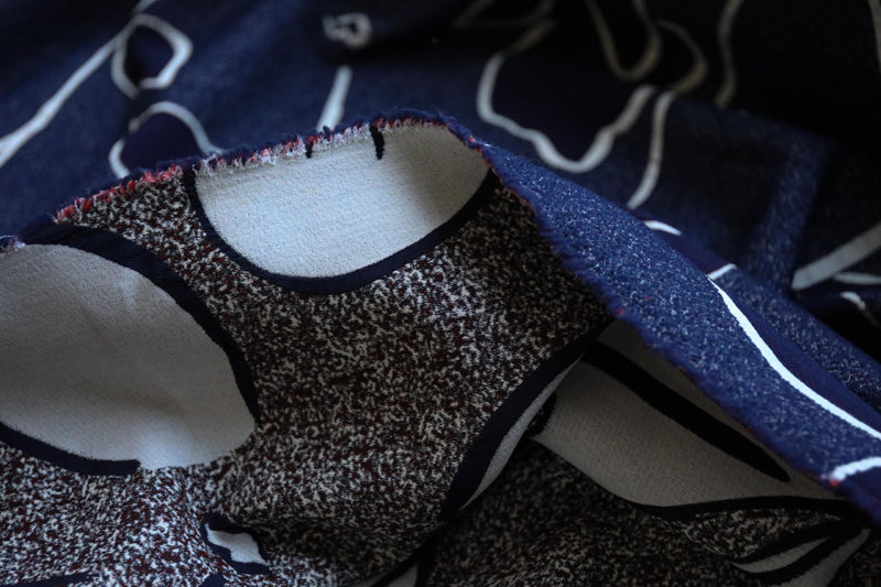 Face on navy jacquard light coating