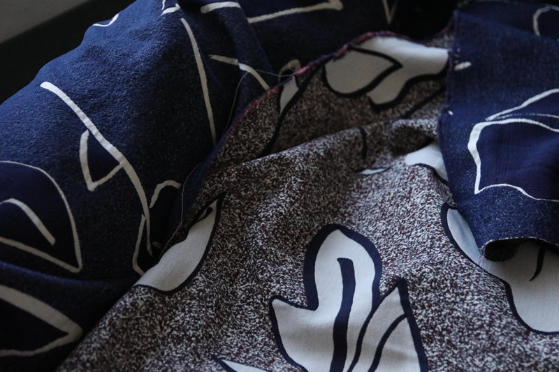 Face on navy jacquard light coating