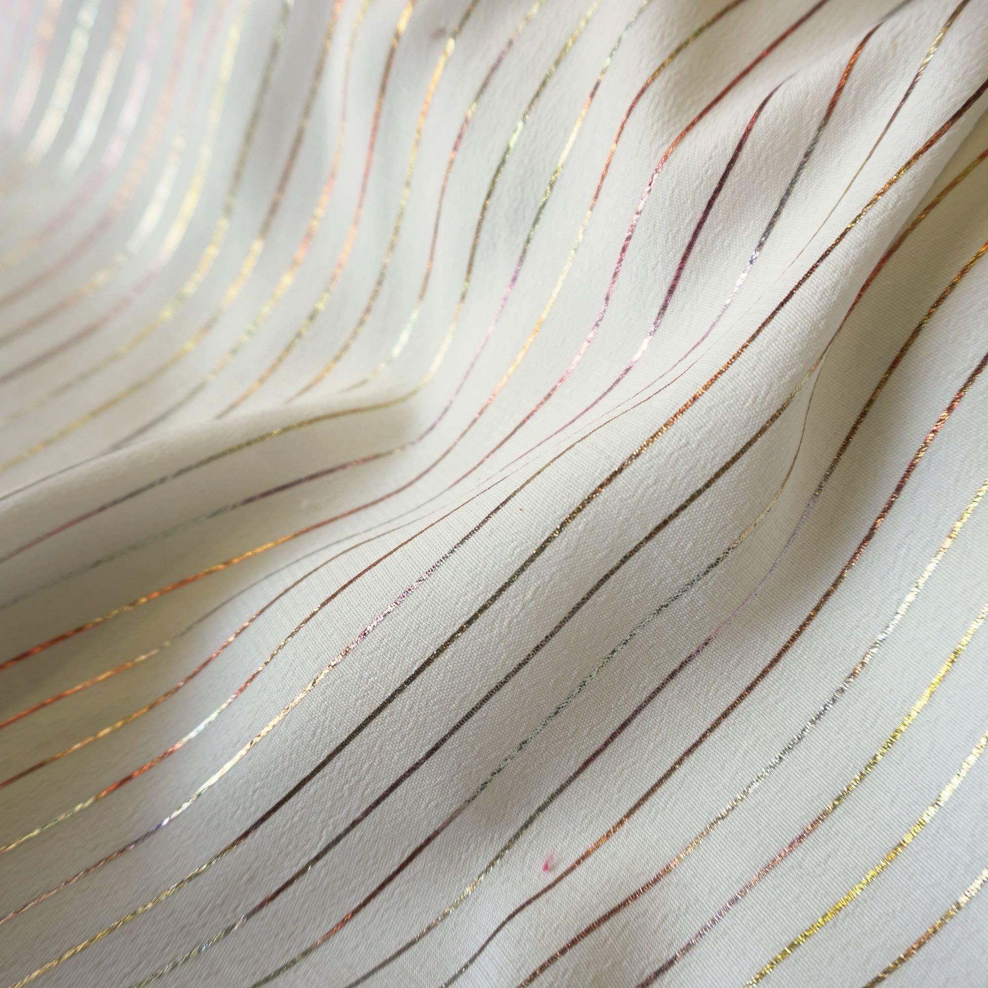 Metallic pin stripe viscose crepe fabric